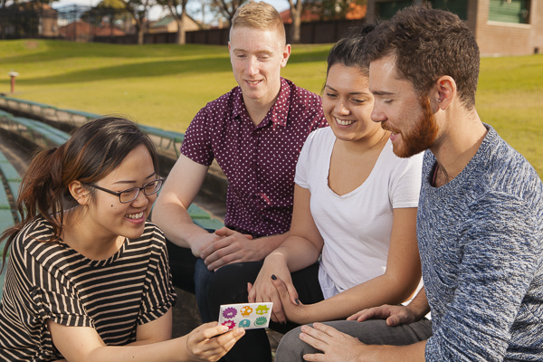 Student's looking at a safe sex pack