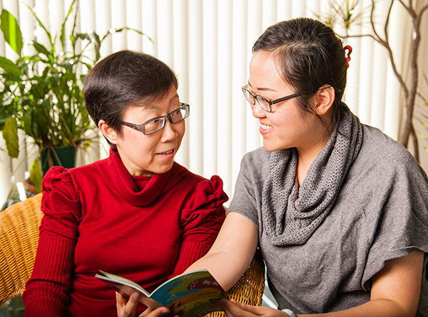 Mother and daughter discussing booklet