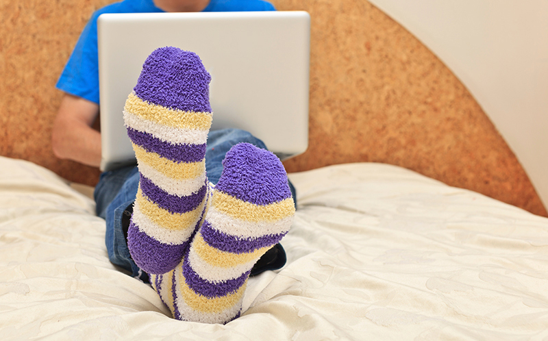 Person with socks on in bed