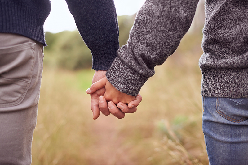 Couple holding hands